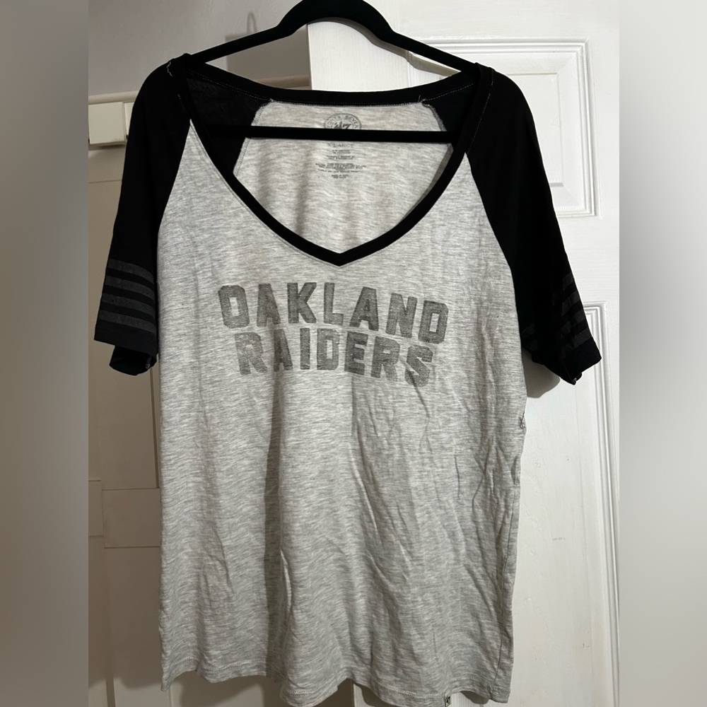 Authentic Oakland Raiders t-shirt w/ raiders logo on sleeve